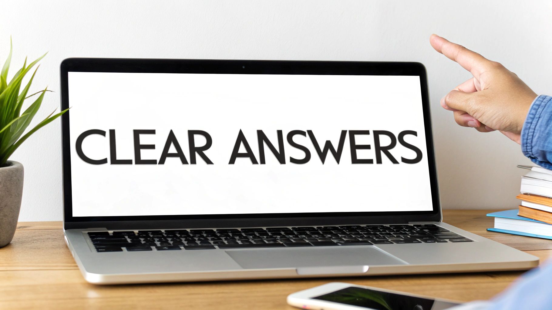 Person pointing at laptop screen displaying clear answers text for voice search optimization