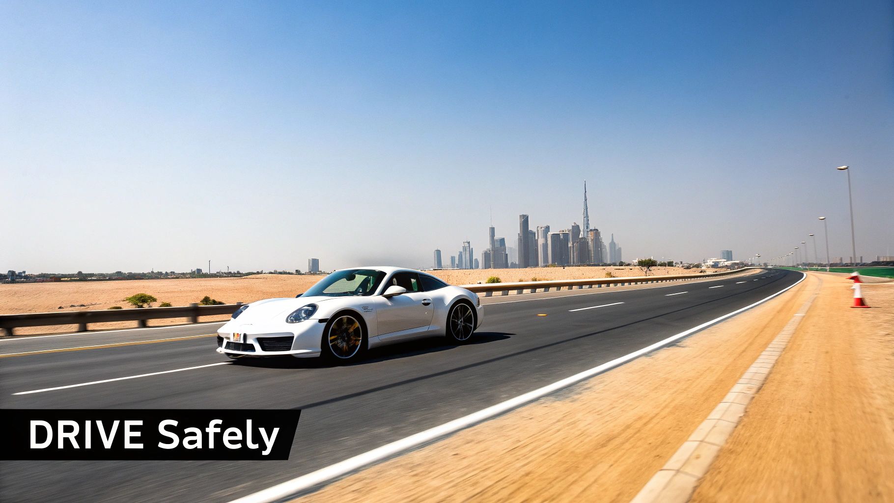 White Porsche sports car driving on modern highway with Dubai skyline in background