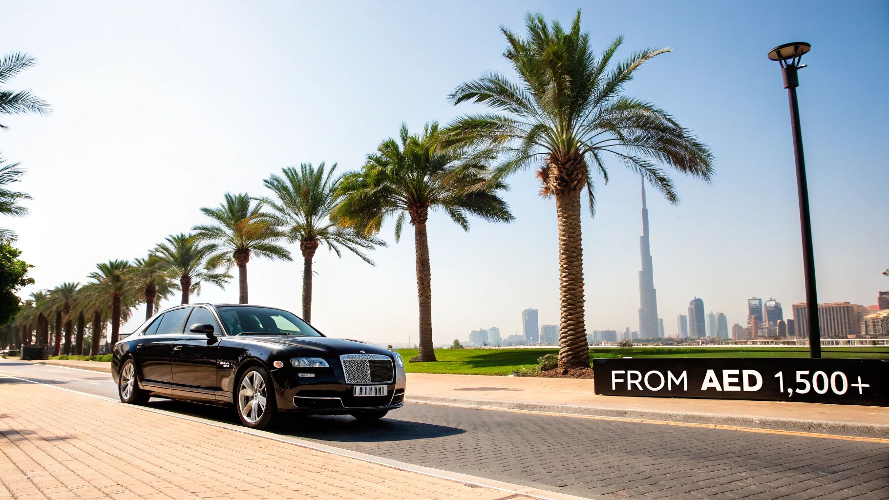 Black luxury car on a Dubai street with palm trees and Burj Khalifa in the background.
