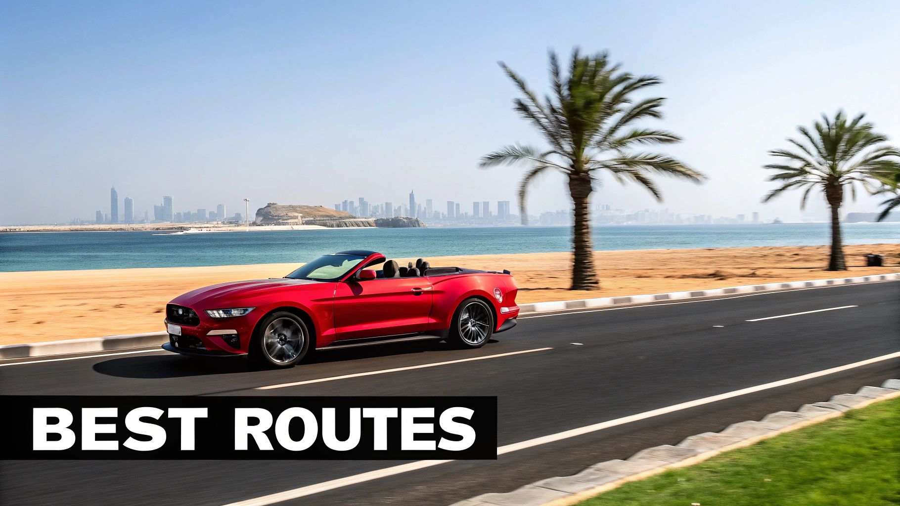 A red Ford Mustang convertible drives on a scenic coastal road with a distant city skyline and palm trees.