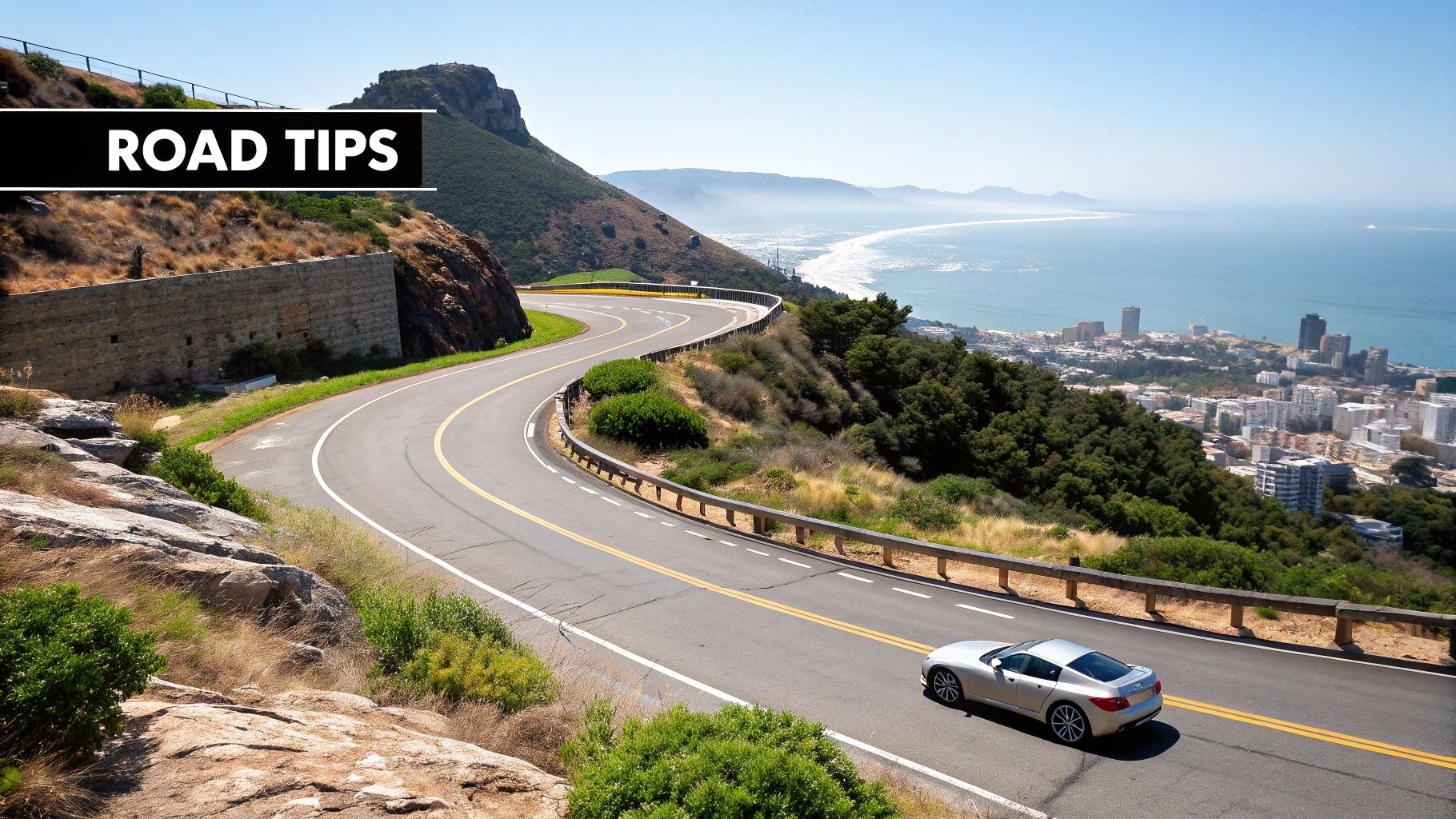 A sports car driving on a scenic road in the UAE
