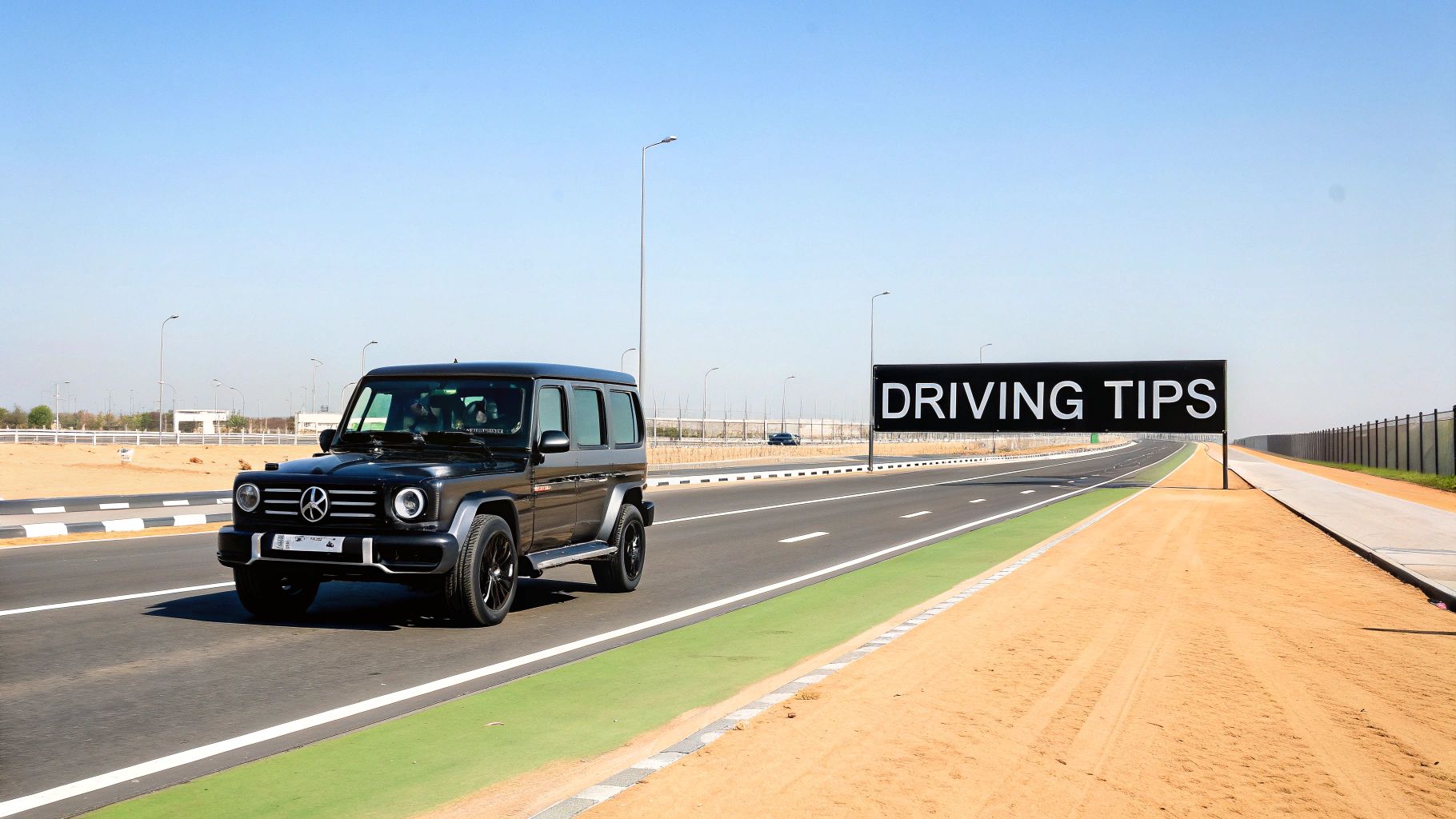 Your Guide to G63 for Rent in Dubai 4 A black Mercedes-Benz G63 SUV drives on a desert road next to a "DRIVING TIPS" sign.