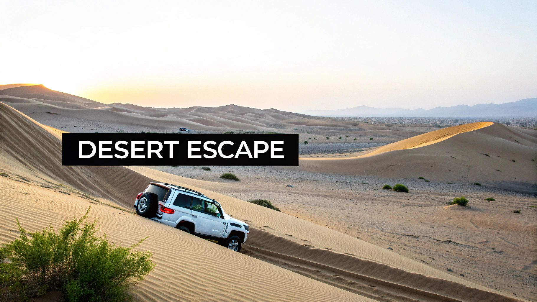 Discover the Top 10 Best Road Trips in UAE for 2026 1 A white SUV drives down a steep sand dune in a vast desert landscape at sunset.