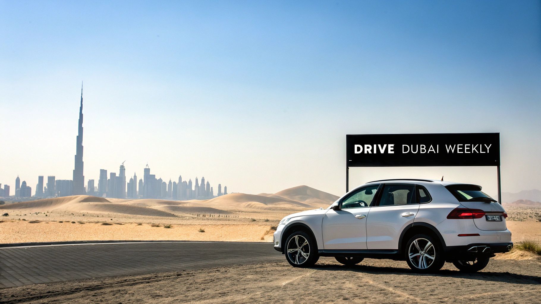 A luxury car parked in front of the Dubai skyline at sunset