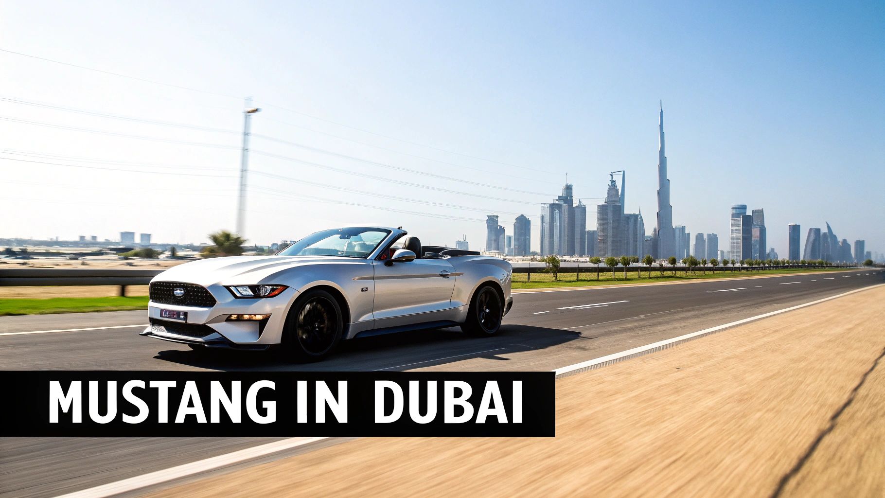 Your Guide to Mustang Dubai Rent 1 A silver Ford Mustang convertible drives on a road in Dubai with the city skyline and Burj Khalifa in the background.
