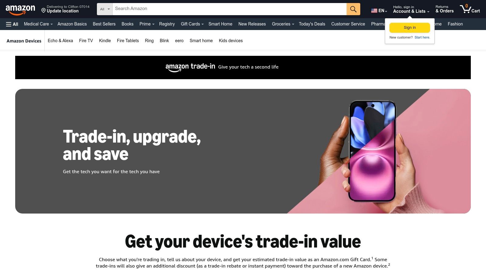 An assortment of electronics like a Kindle, phone, and gaming controller ready for trade-in on Amazon's platform.