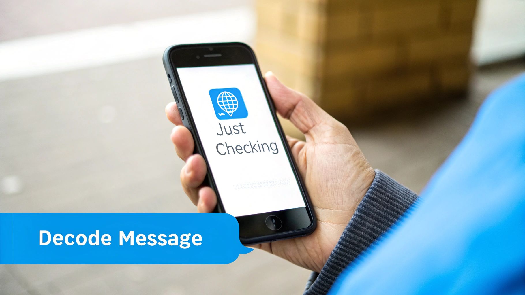 Person holding smartphone displaying Just Checking app with globe icon and decode message text