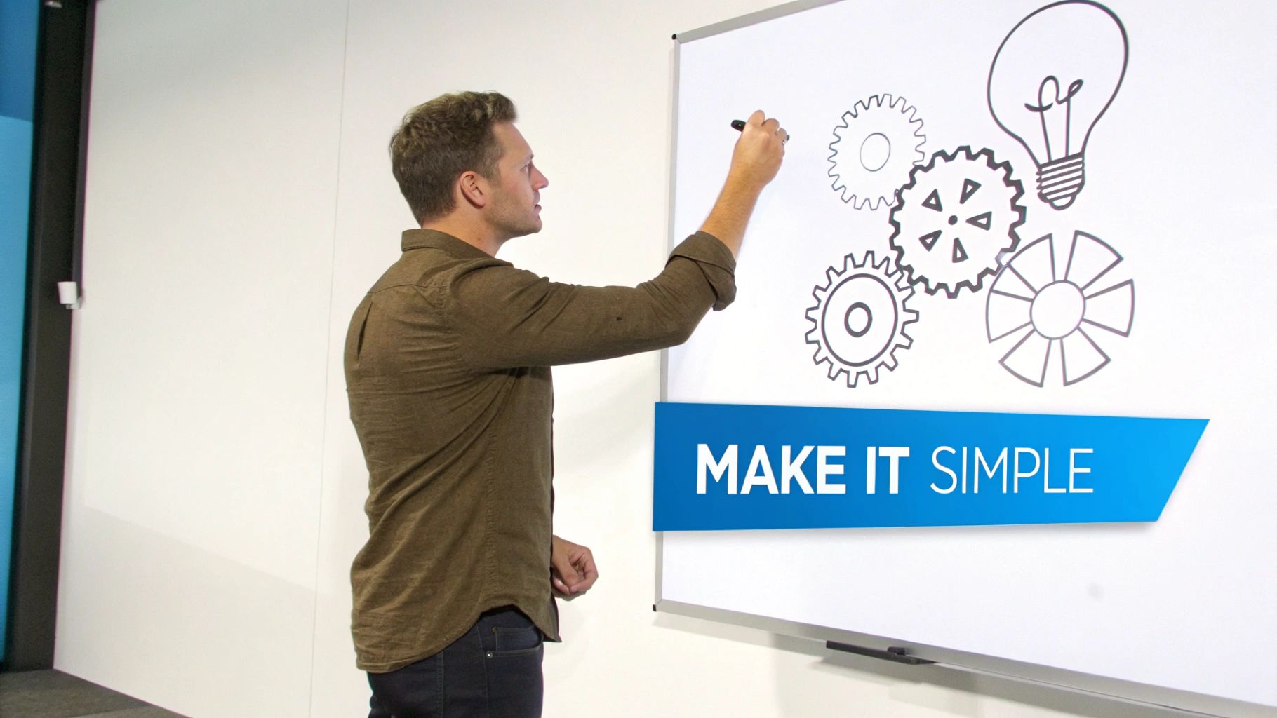 A man draws gears and a lightbulb on a whiteboard with the text "MAKE IT SIMPLE" visible.