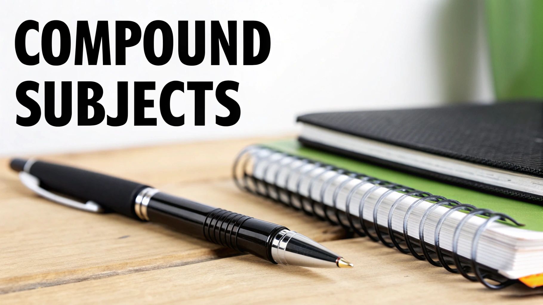 A close-up of a pen and notebooks on a wooden desk with the text 'COMPOUND SUBJECTS'.