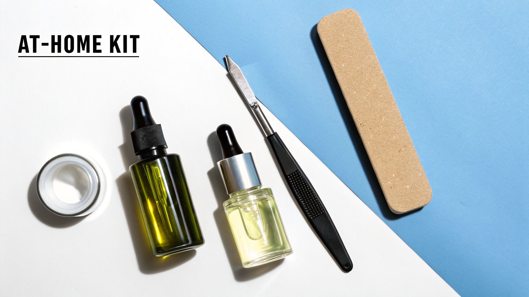 An at-home nail care kit featuring two dropper bottles, a nail file, and a cuticle tool.