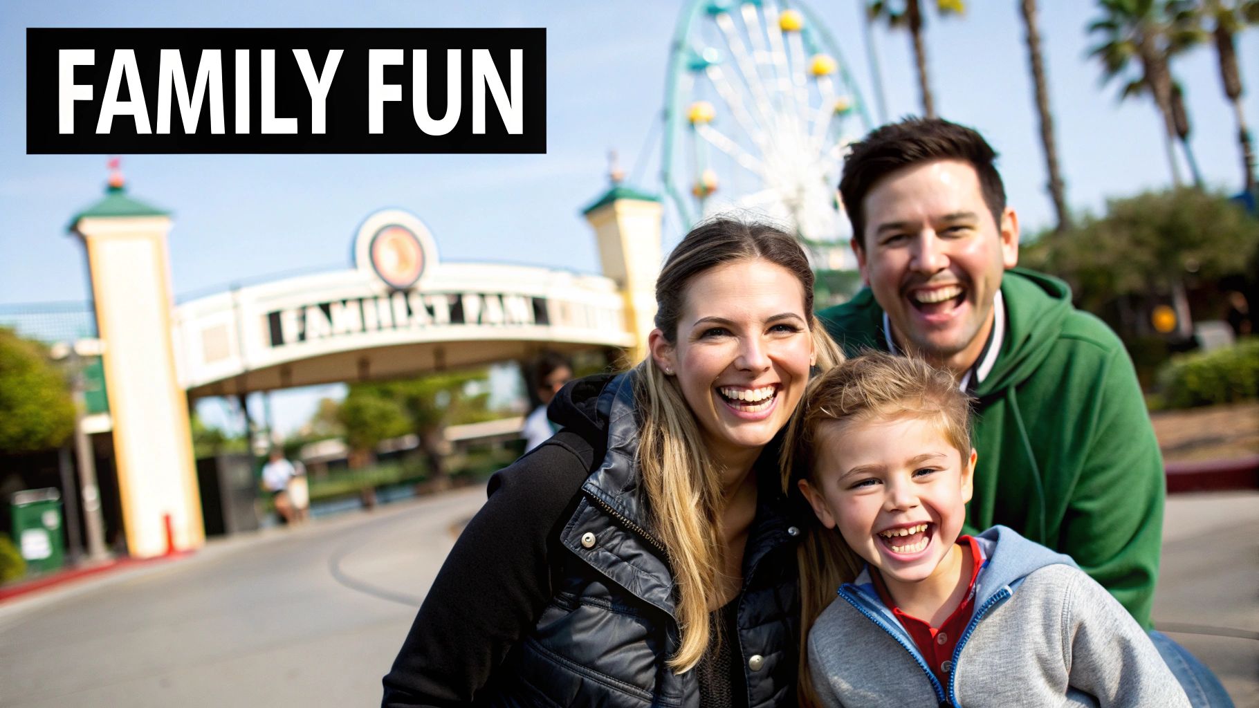A joyful family, mother, father, and son, laugh together at an amusement park entrance with a Ferris wheel.