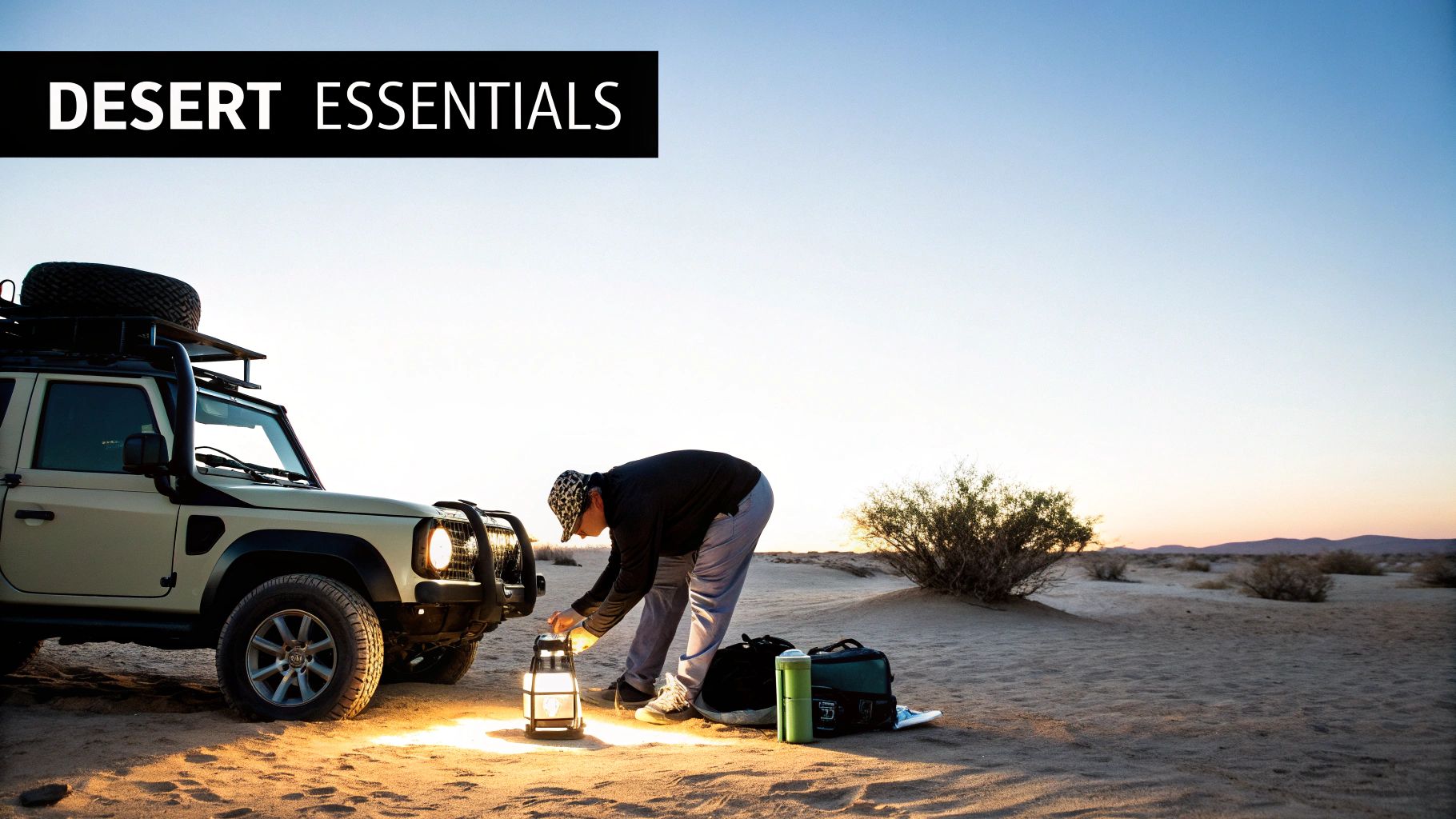 Person lighting a lantern next to an off-road vehicle in a desert at dusk, with camping gear.