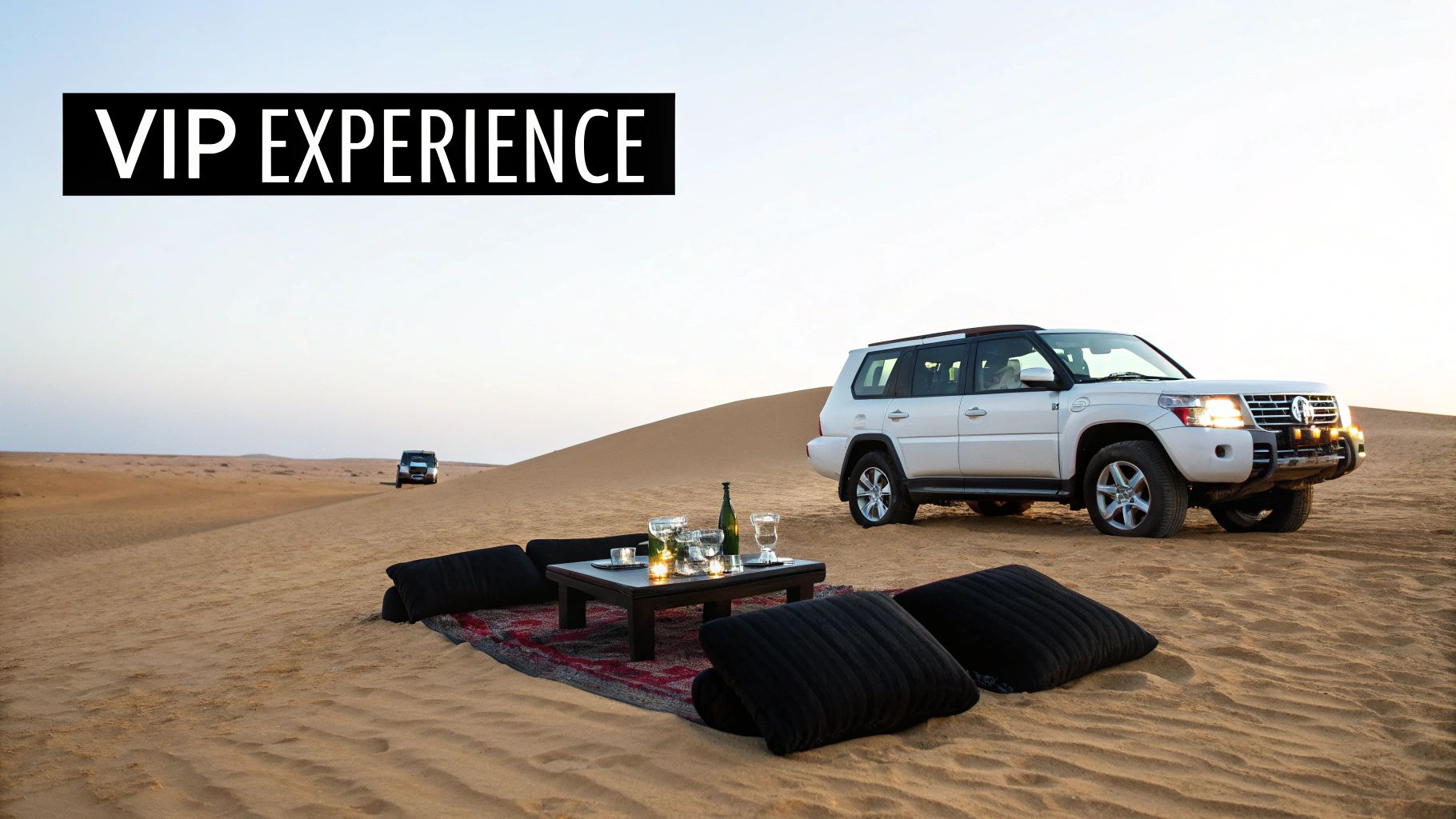 A luxurious VIP desert experience with a white SUV, elegant table setup, and cushions on sand dunes.