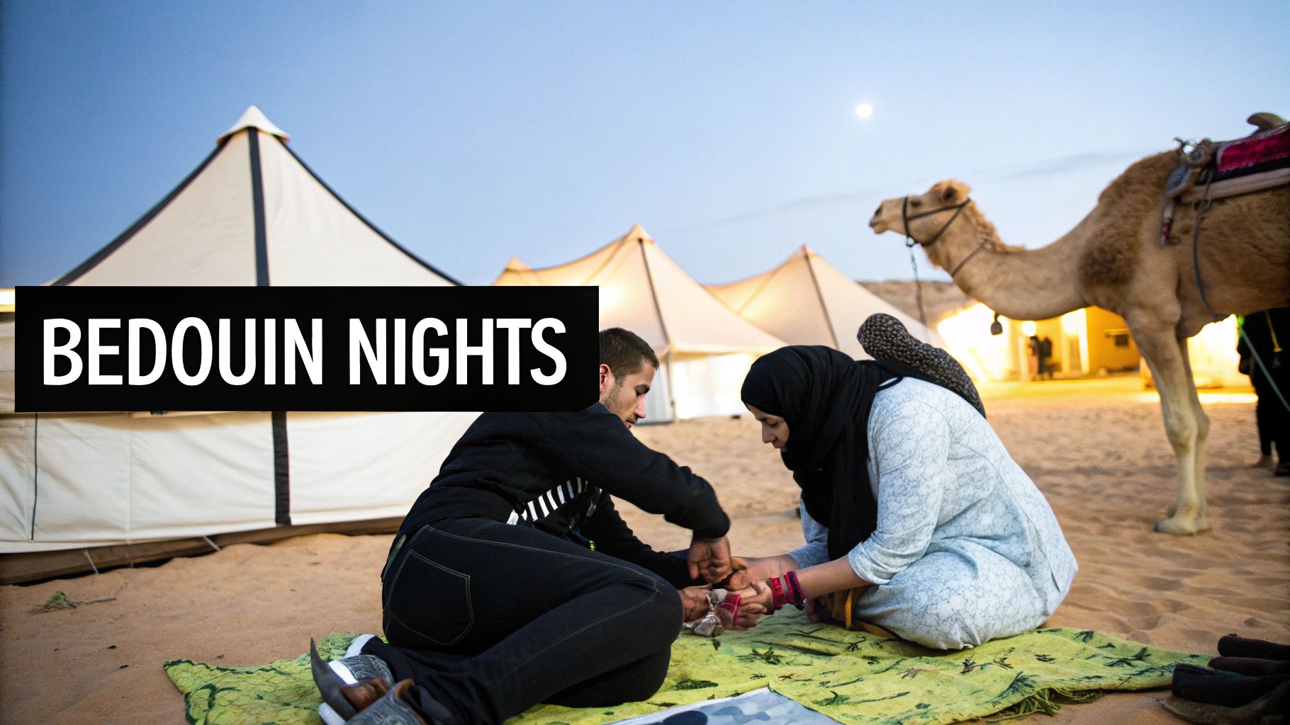 Two people sitting on a mat in a desert camp with tents, a camel, and the moon visible.