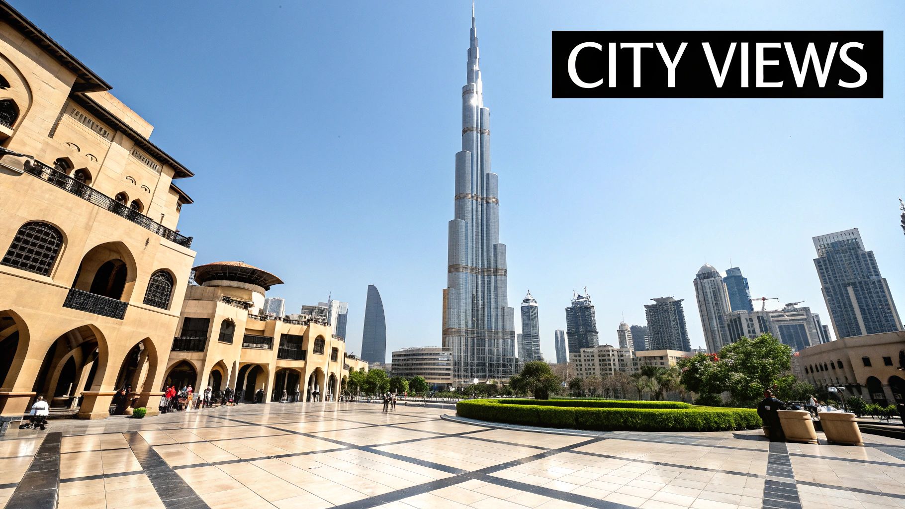 Panoramic view of Dubai's iconic Burj Khalifa skyscraper towering over modern and traditional buildings.