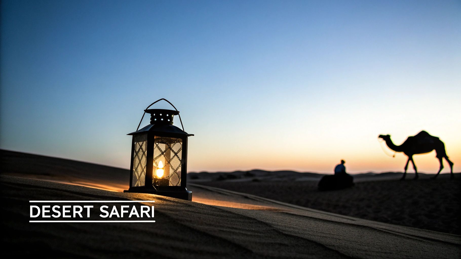 A glowing lantern on a sand dune, with a camel and person silhouetted against a desert sunset.