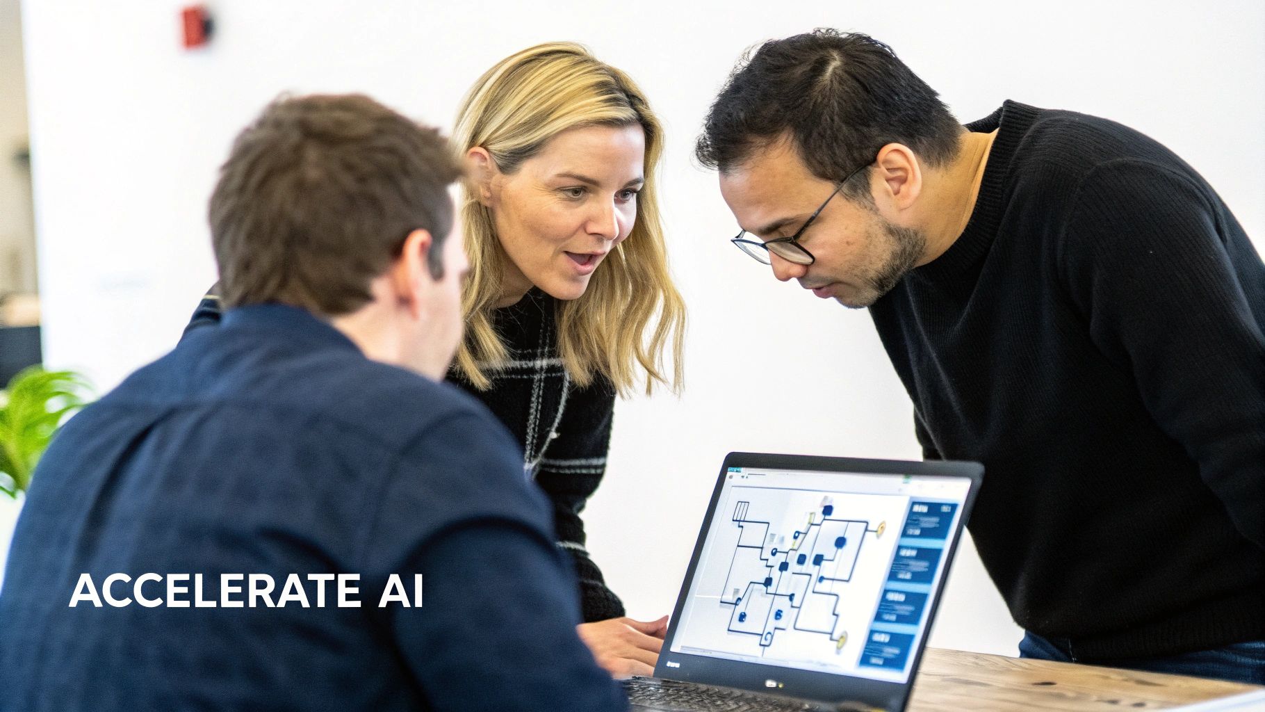 Three colleagues collaborate, looking at a laptop screen displaying a technical diagram in an office setting.