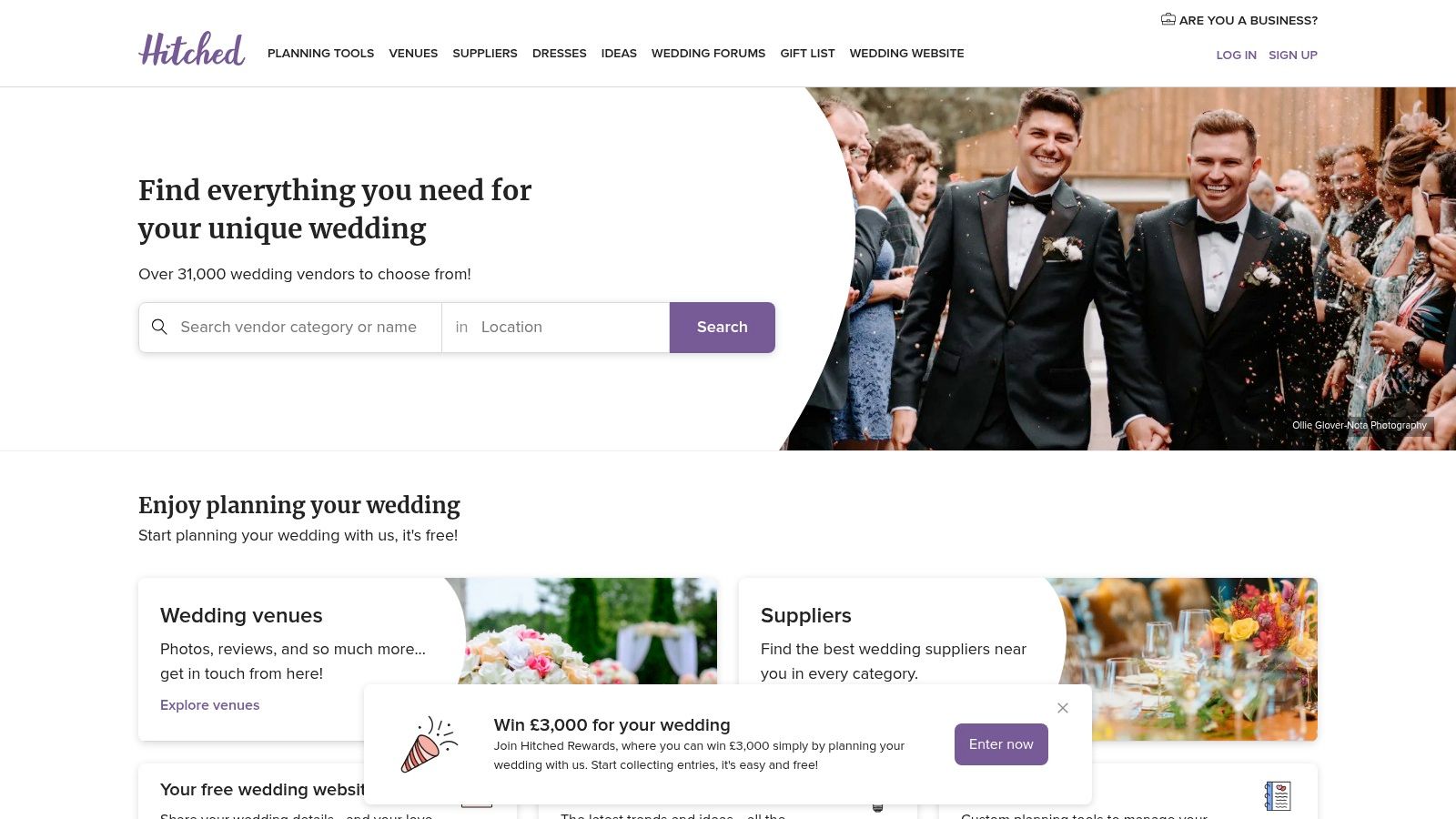 Two grooms smiling during their wedding ceremony