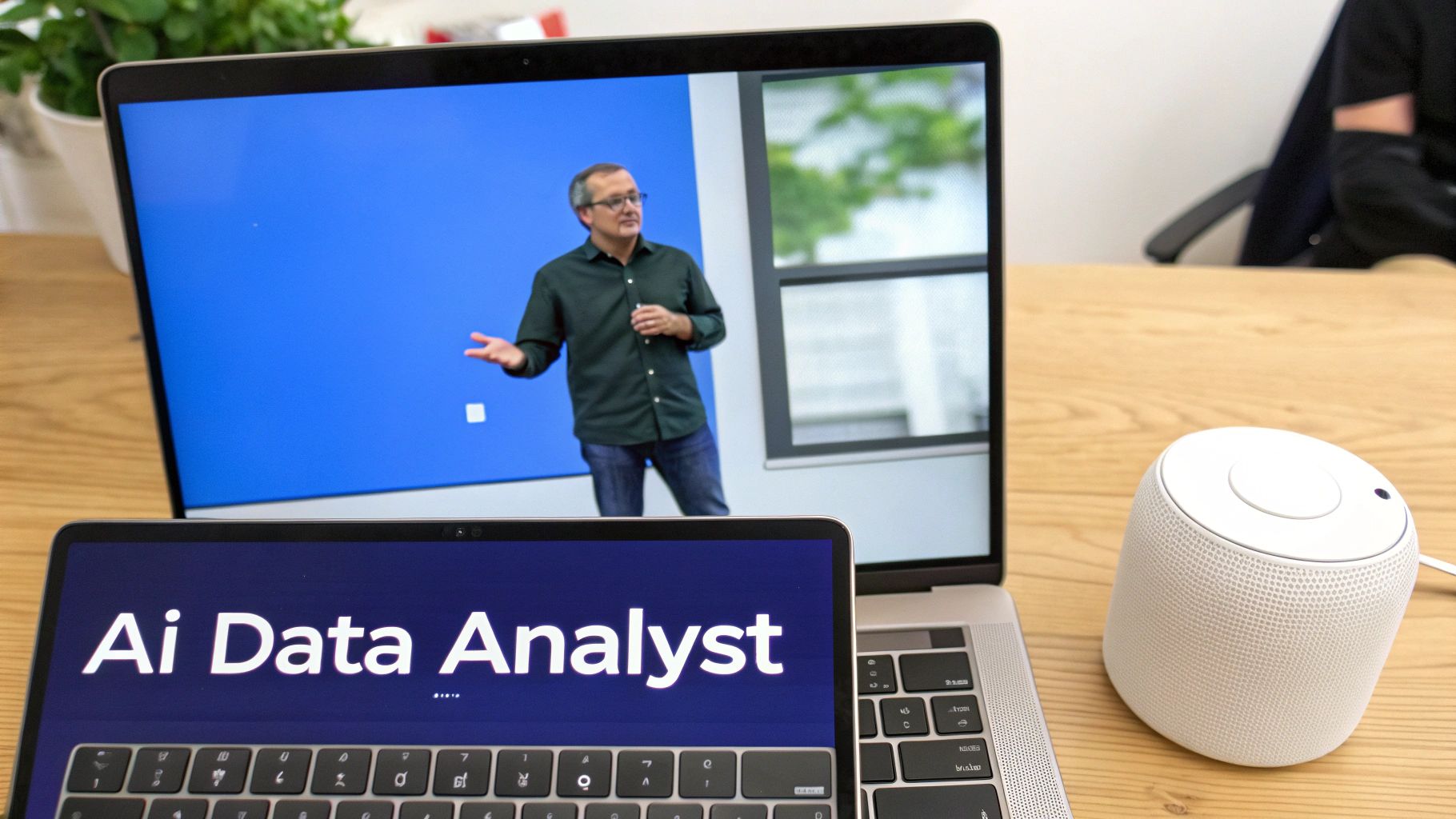 Laptops on a wooden desk: one showing "Ai Data Analyst", the other a presentation, next to a smart speaker.