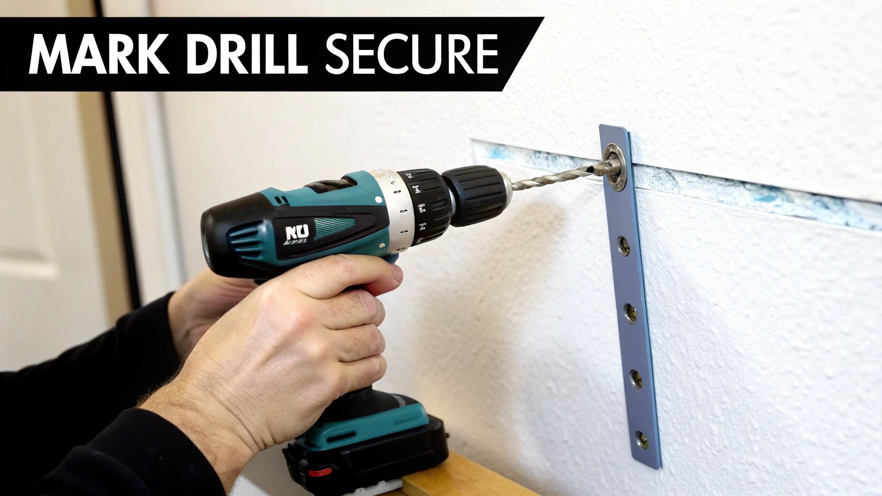 A person uses a teal and black power drill to create a hole in a white textured wall, aligning it with a metal bracket.
