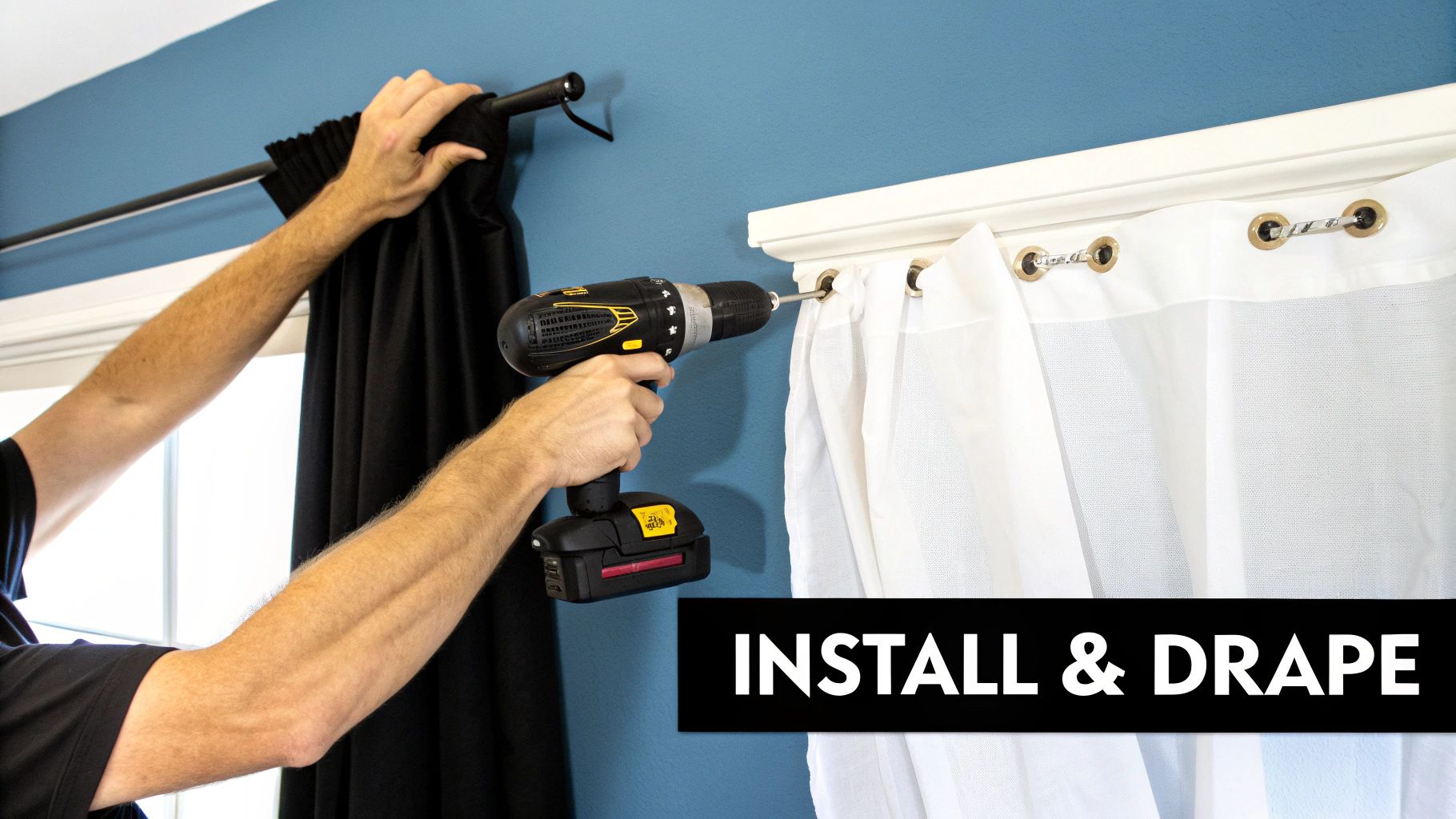 A person installs white and black curtains using a drill, drapes them on a rod against a blue wall.