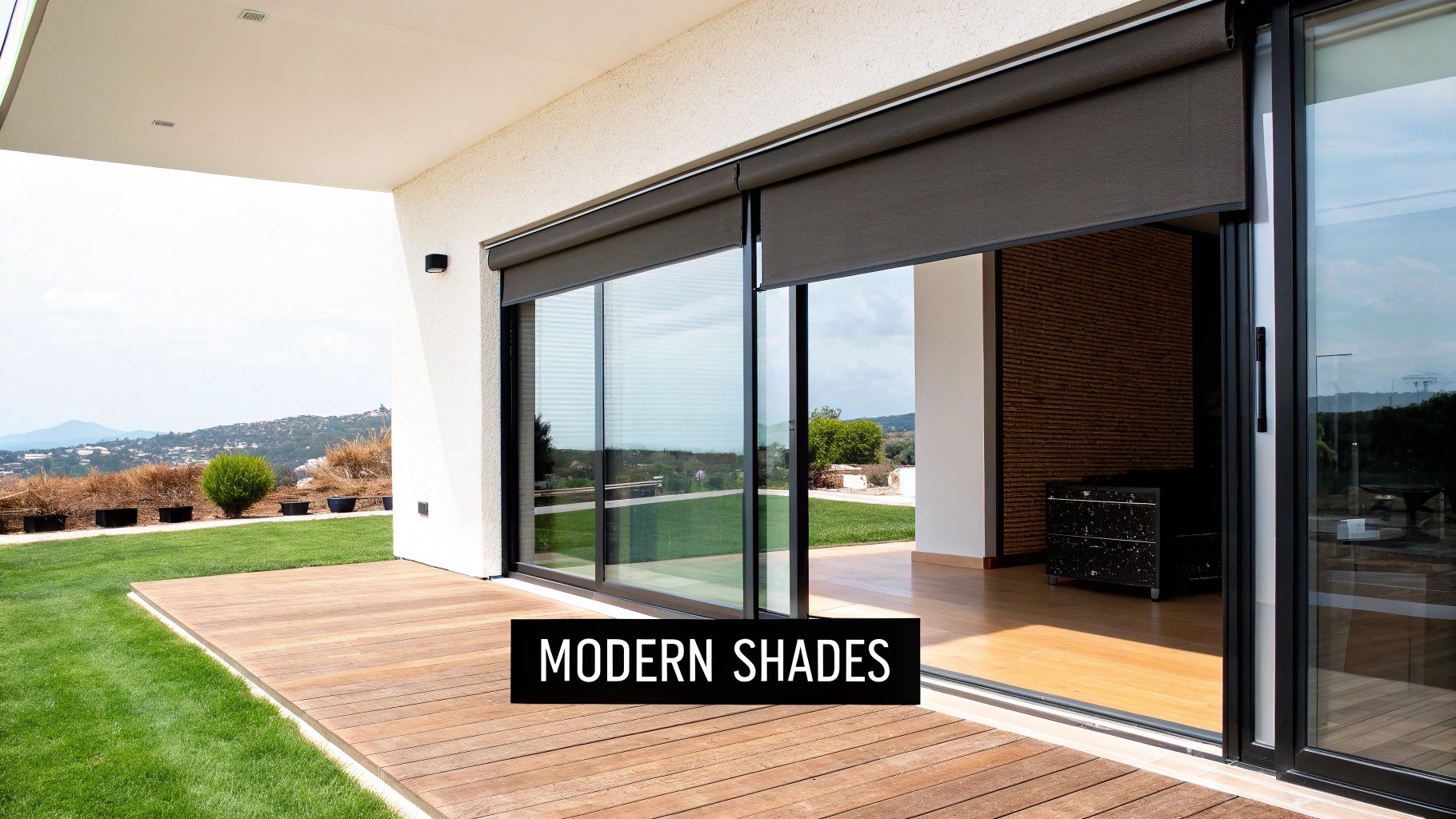 A modern living room with a glass door featuring a light-filtering cellular shade.