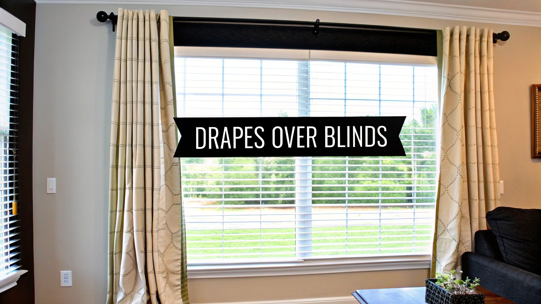 Light-colored drapes with a subtle pattern are elegantly layered over white horizontal blinds on a large window.