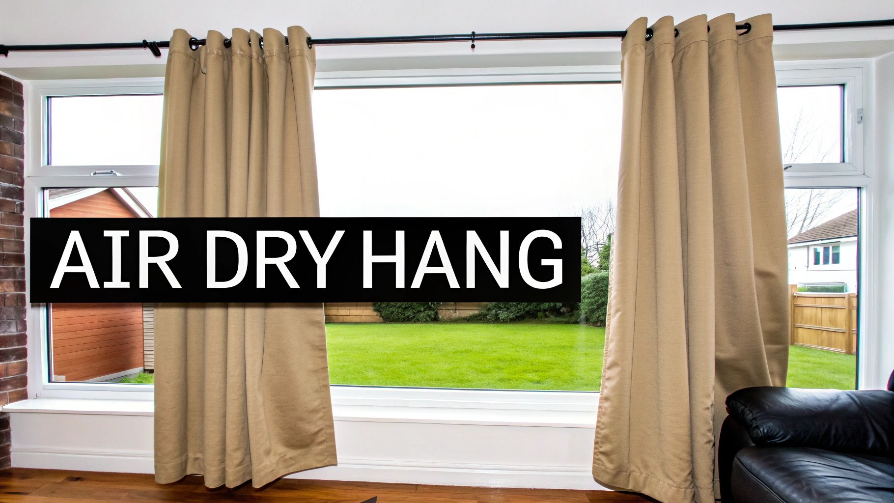 Beige eyelet curtains hanging in a large window, with 'AIR DRY HANG' text overlay, showing a garden view.