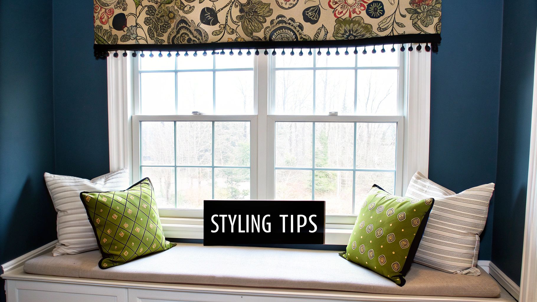 A beautiful window featuring a layered look with a tailored valance over sheer curtains.