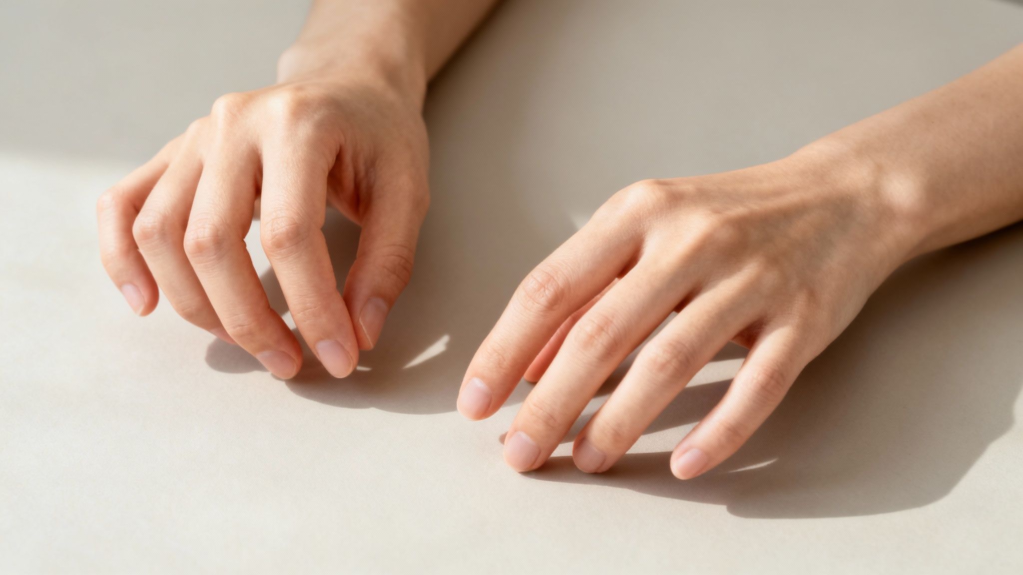 Gentle finger exercises being performed by someone with arthritis