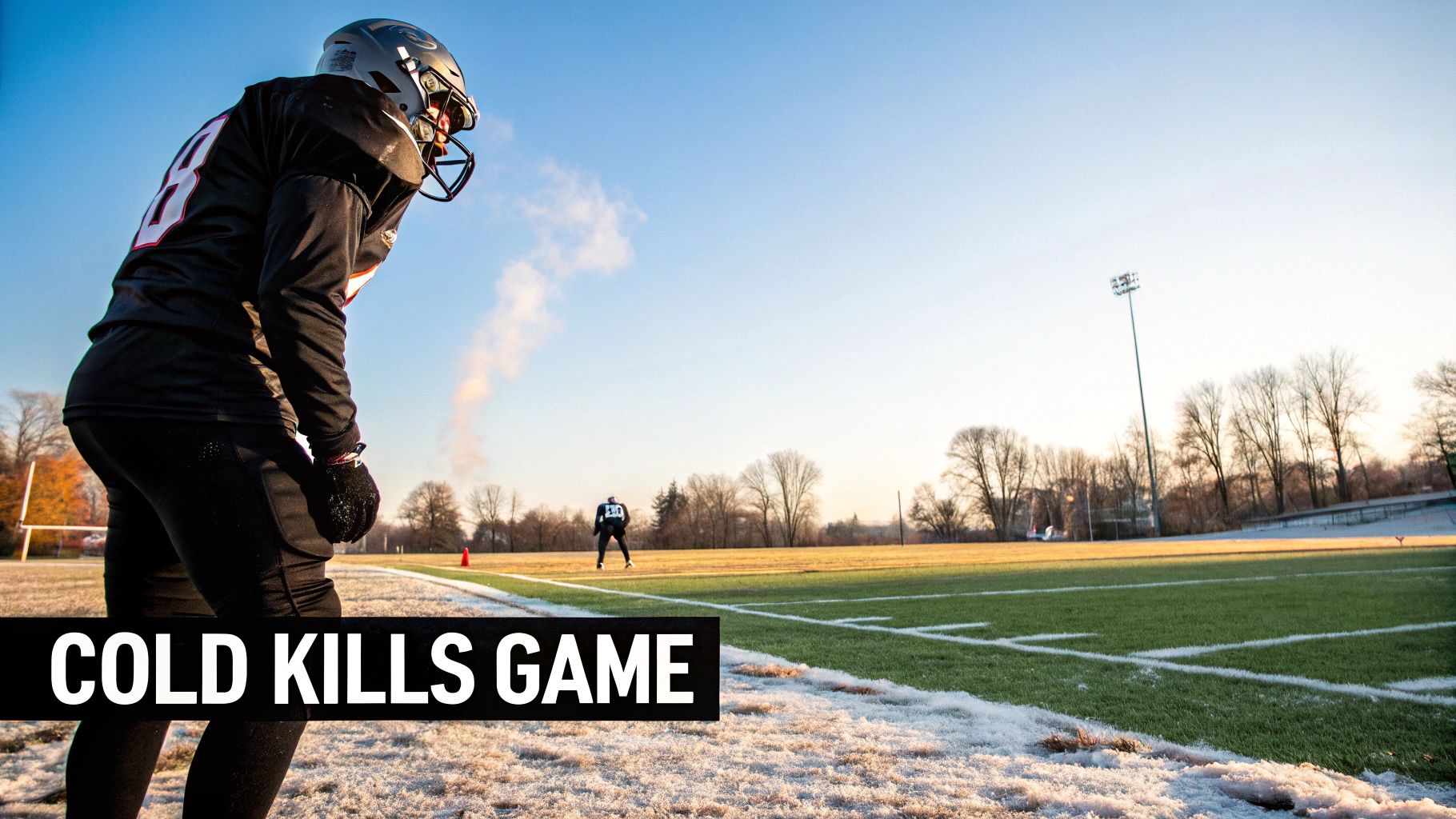 A football player adjusting heated gloves on a cold day
