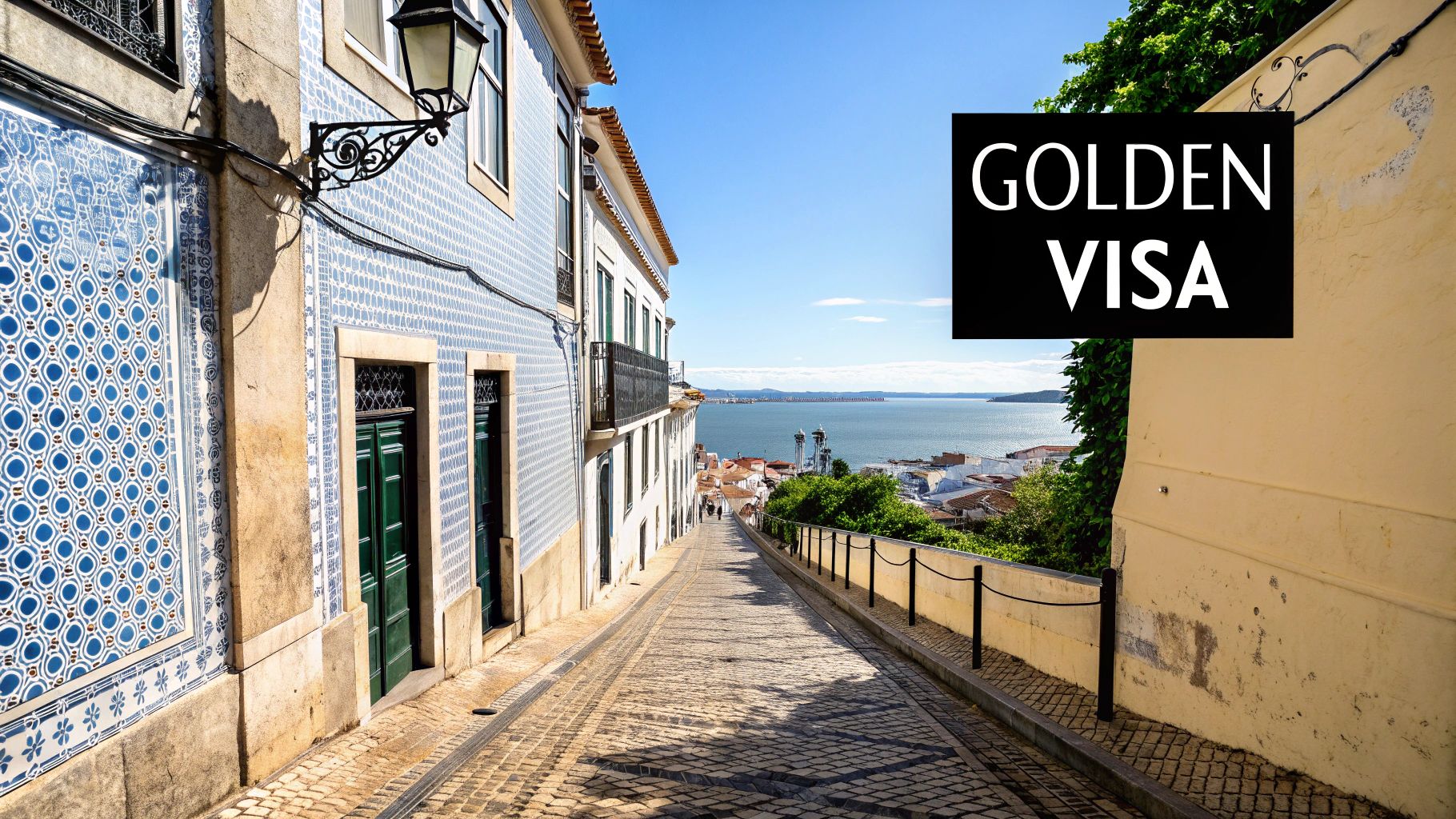 A narrow, charming street in Lisbon, Portugal, with blue tiled buildings leading down to a river, featuring a 'GOLDEN VISA' overlay.