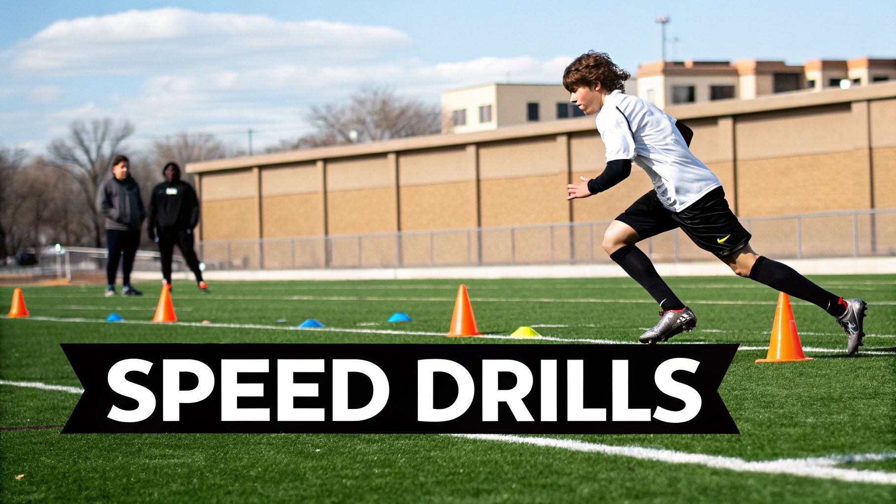 A footballer performing a speed drill with cones.