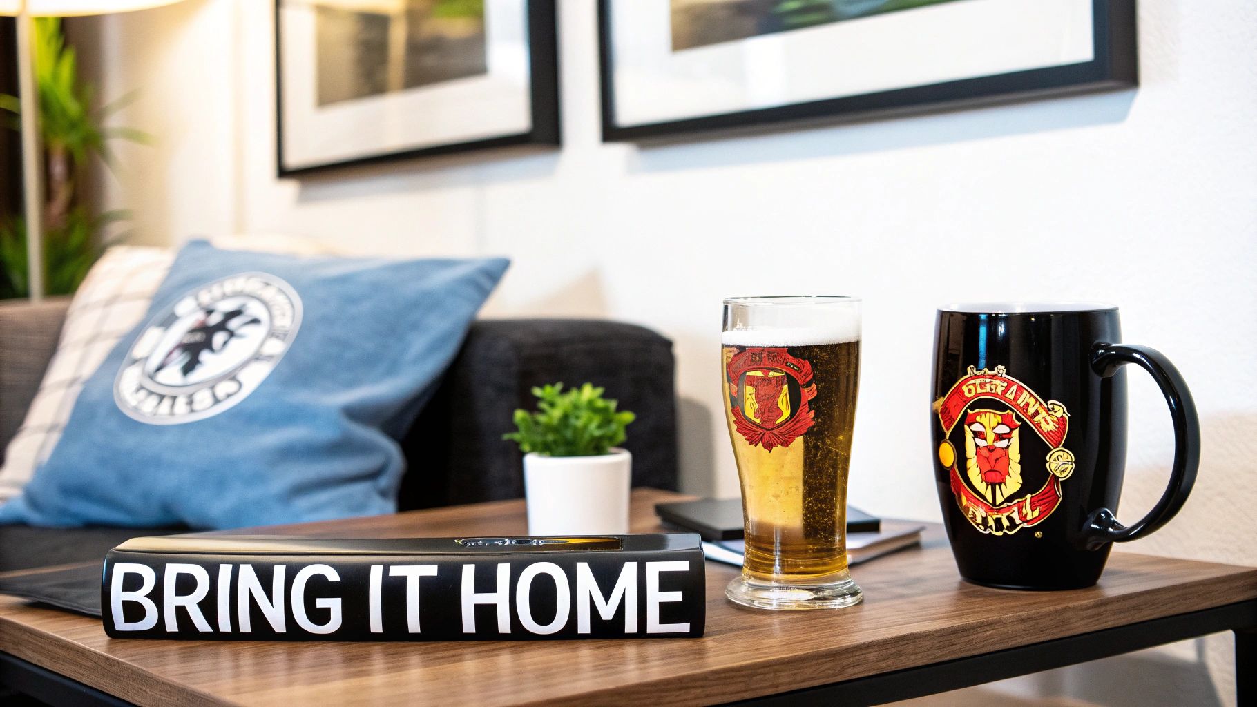 A Manchester United themed mug and coaster set on a wooden table.