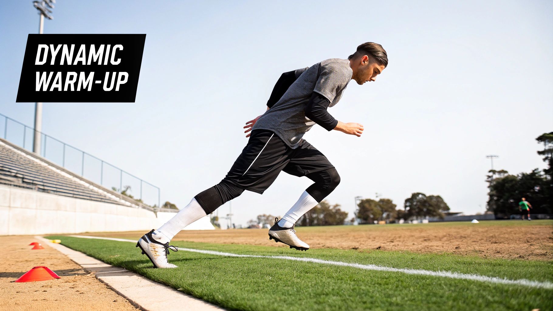 Two footballers performing a dynamic warm-up on a pitch.