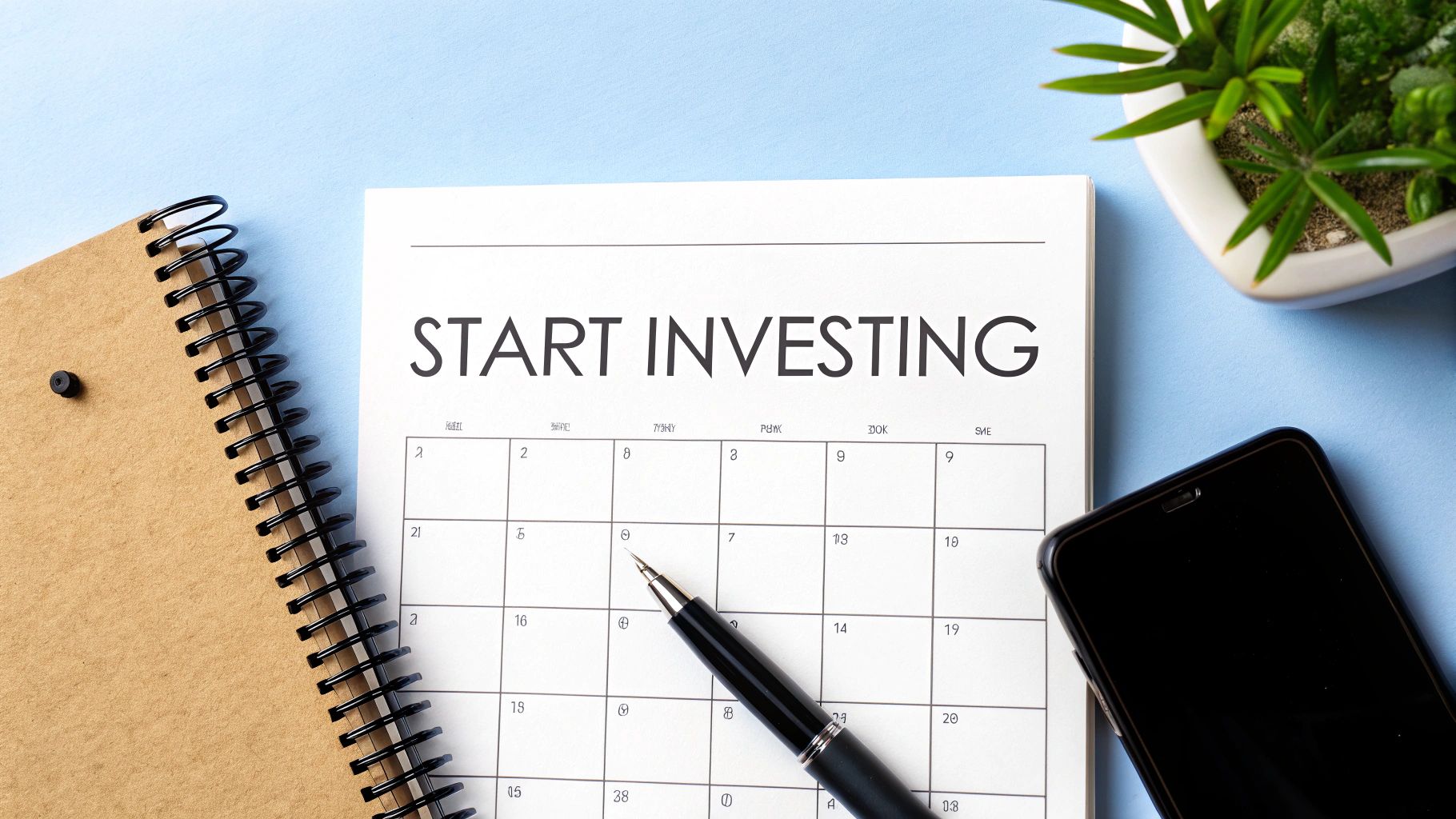 A calendar titled 'START INVESTING' with a pen pointing to a date, alongside a notebook and phone on a blue background.