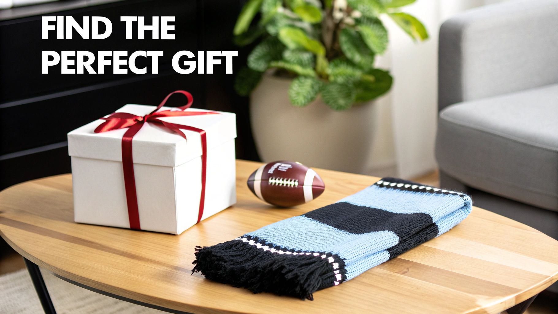 A white gift box with a red ribbon, a football, and a striped scarf on a wooden table, representing perfect gifts.