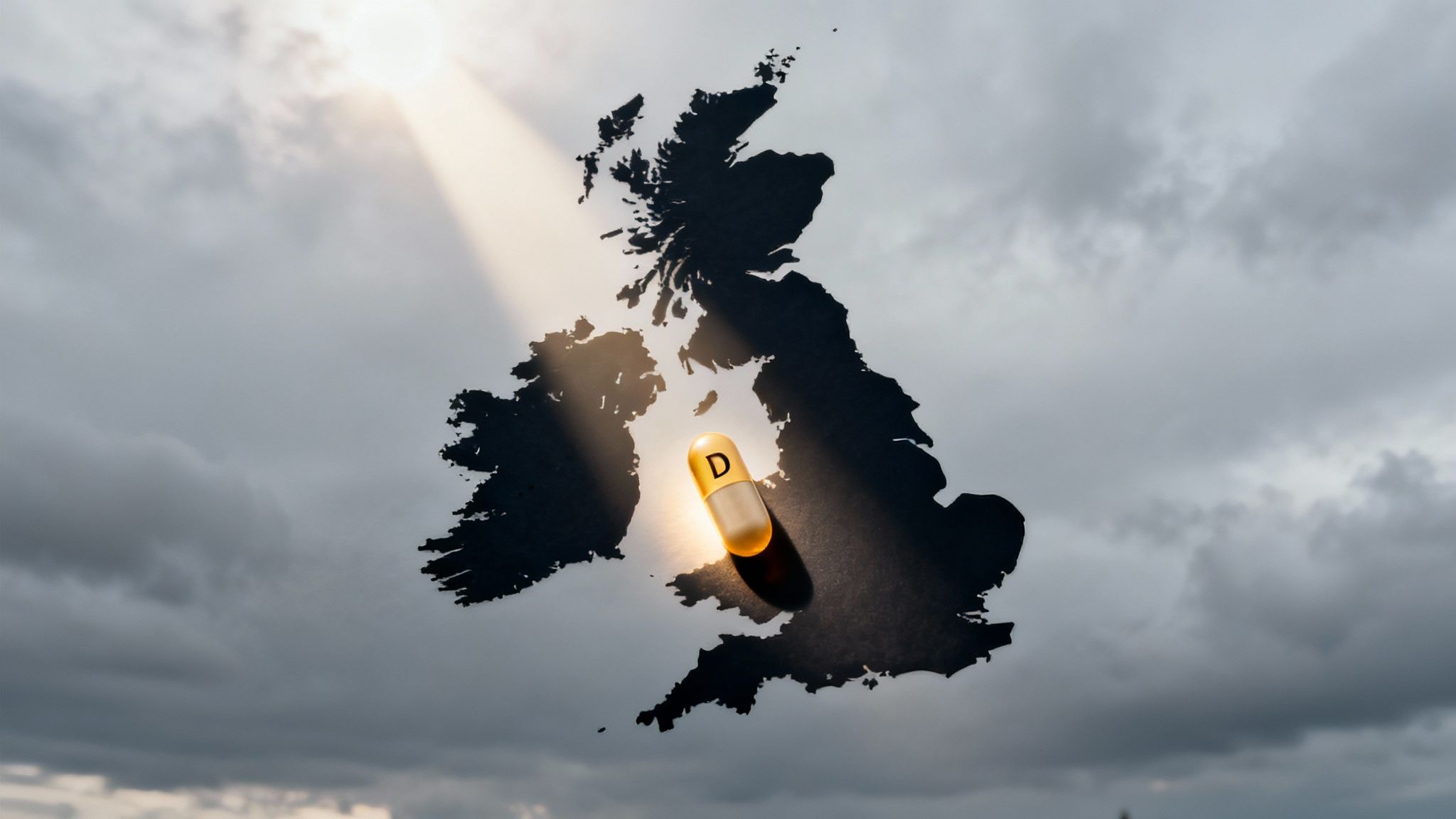 A cup of tea and a bottle of Vitamin D supplements resting on a windowsill on a rainy UK day.