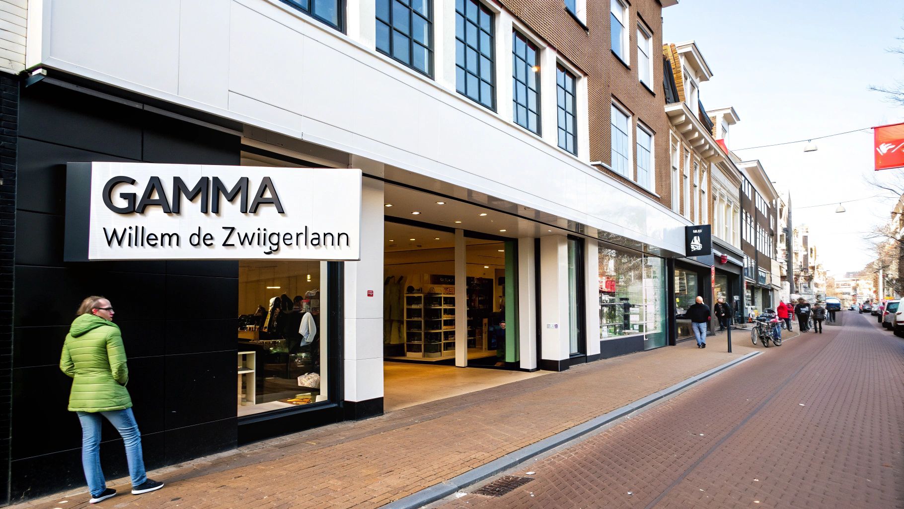 Een GAMMA bouwmarkt aan de Willem de Zwijgerlaan met een persoon in groene jas op de stoep.