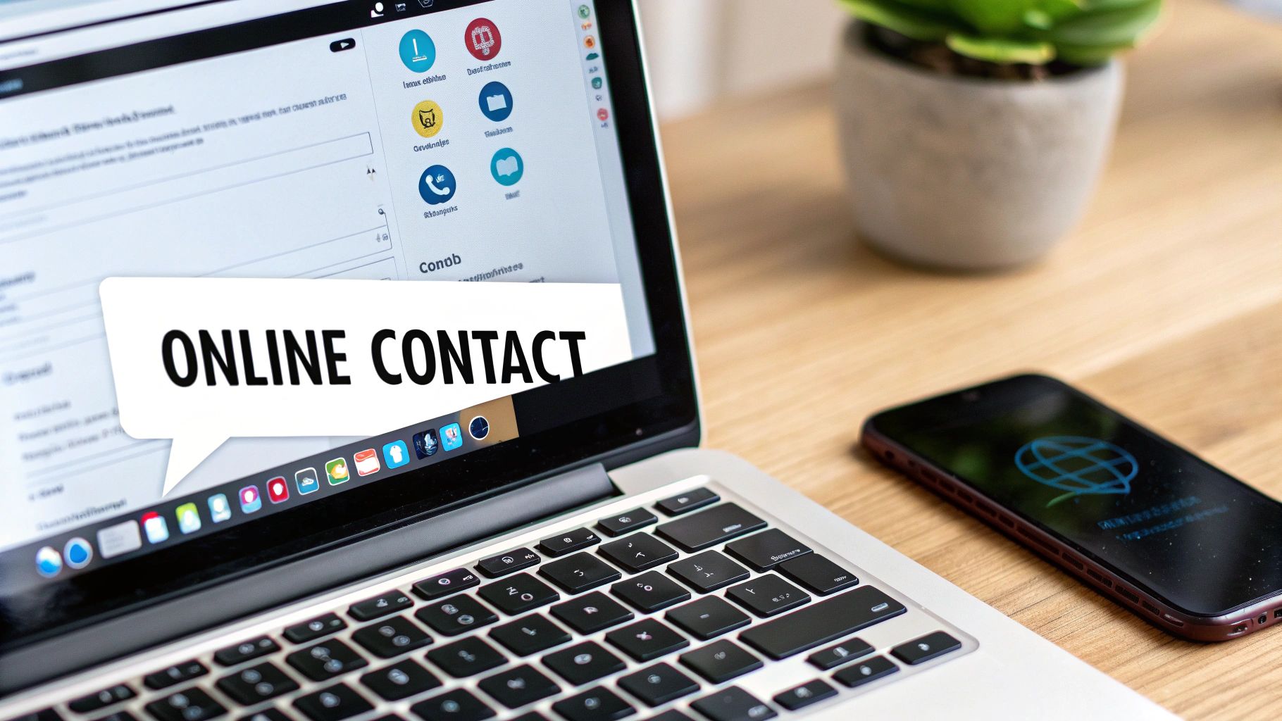 Een laptop en smartphone op een houten bureau, met een tekstballon op het laptopscherm met "ONLINE CONTACT".