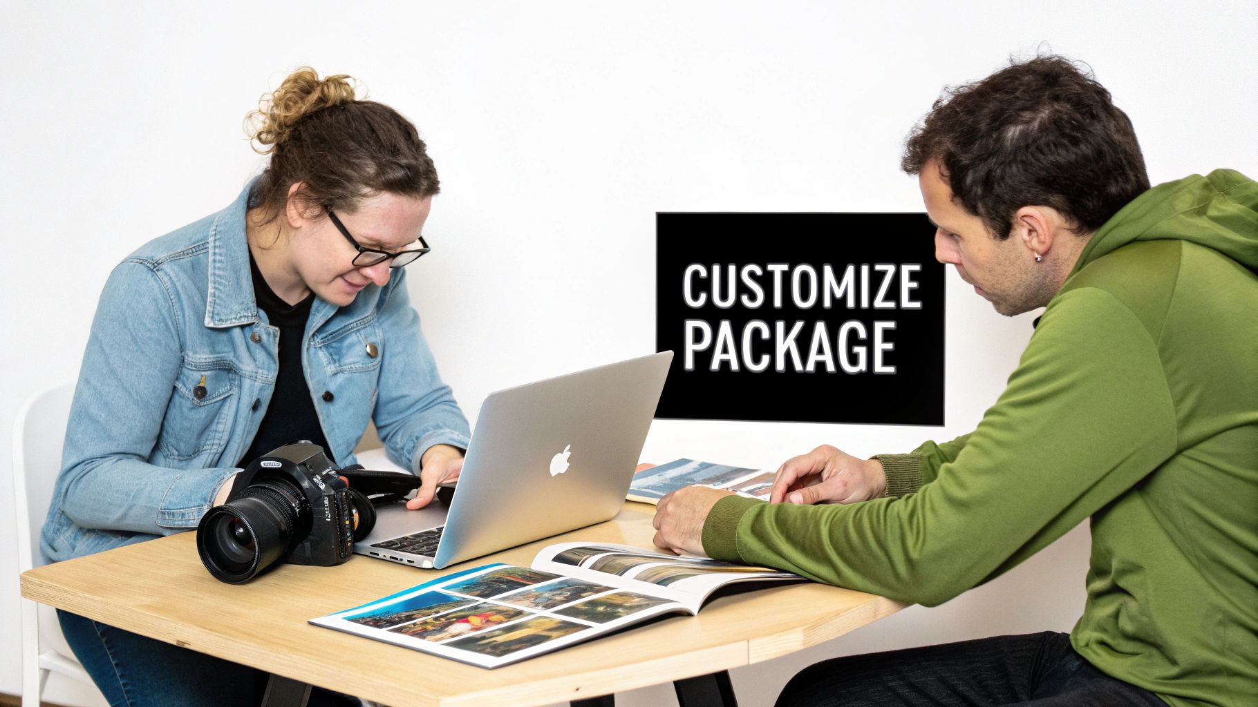 A collection of high-quality photo prints and a custom photo album laid out on a table.