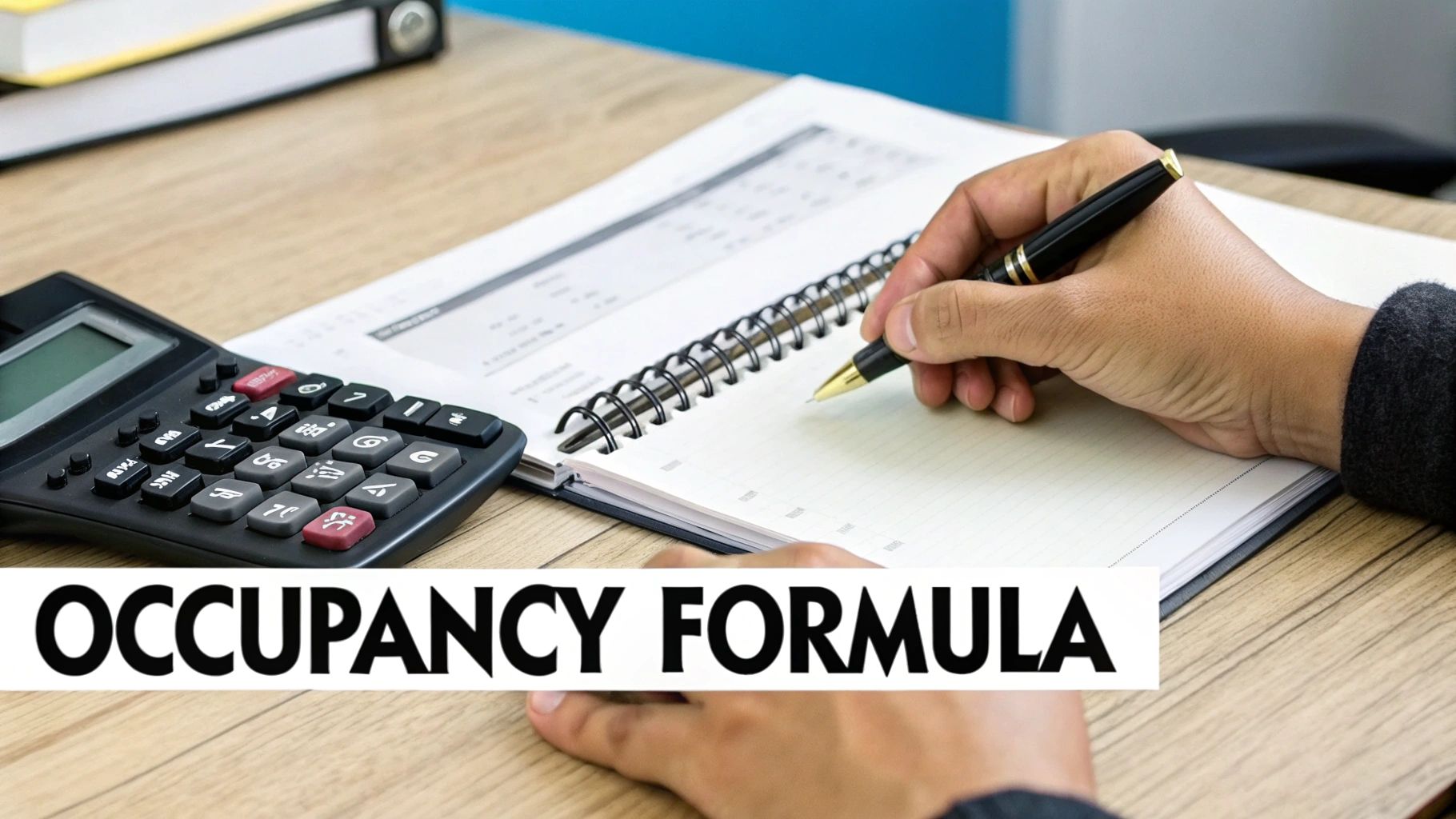 A calculator and a pen lying on architectural blueprints, symbolizing the calculation of occupancy rate for properties.