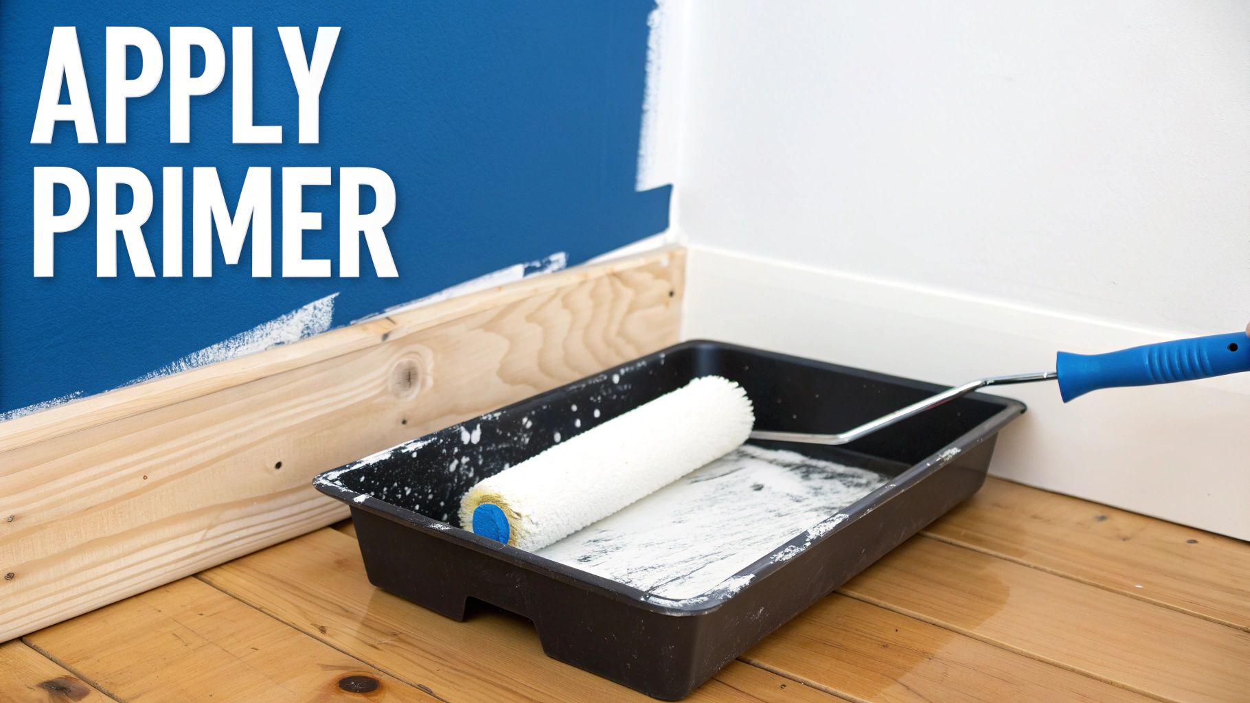 Paint roller and primer in black tray next to wood boards for surface preparation