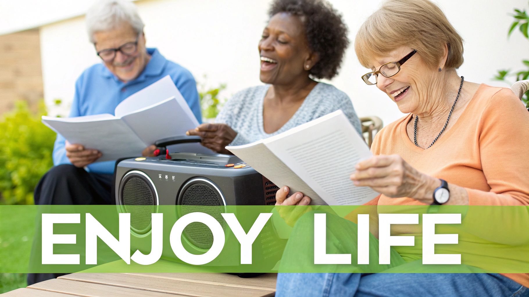 Smiling senior friends reading together outdoors with a stereo, enjoying leisure and companionship.