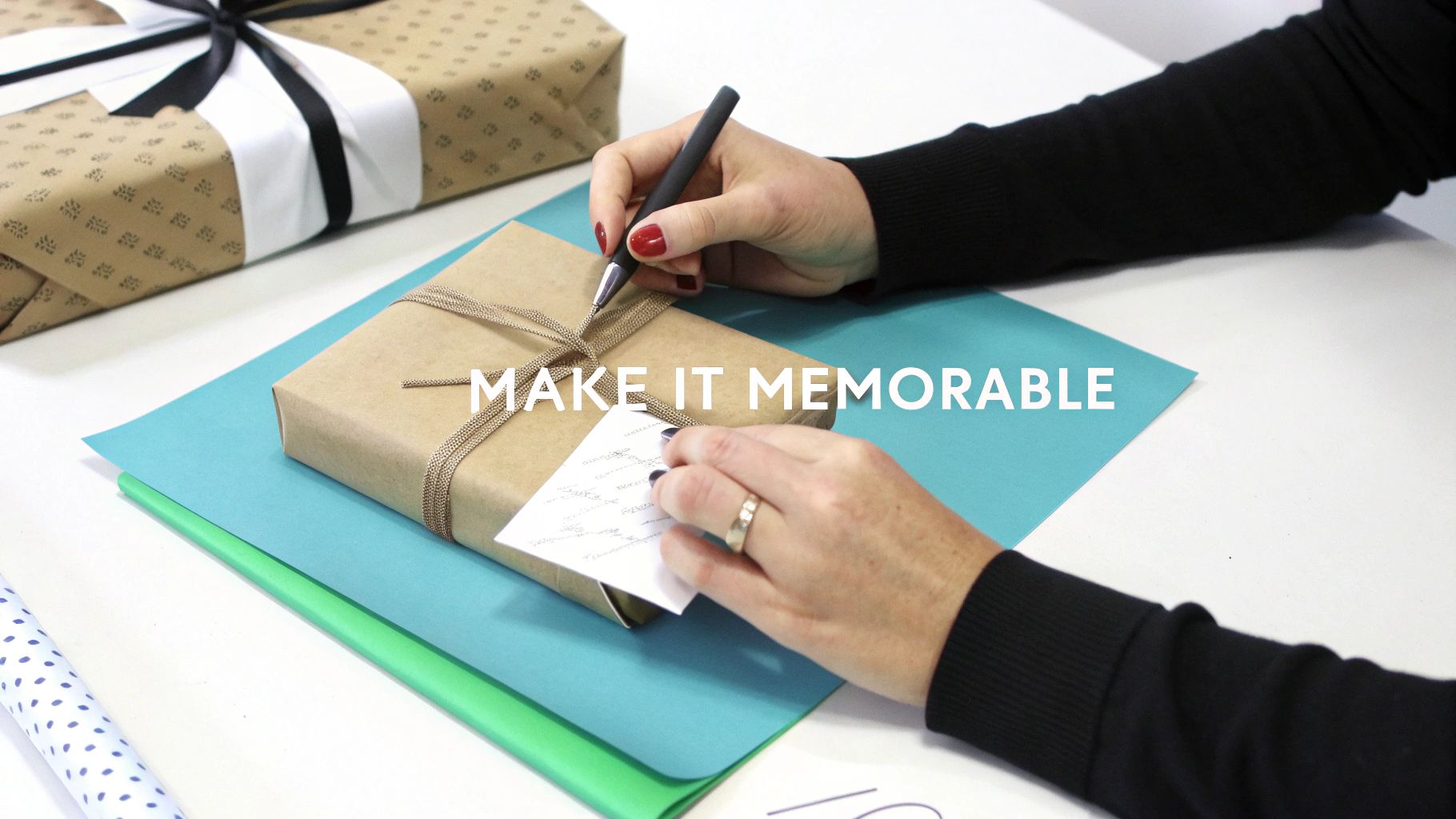 Man happily opening a well-presented gift.