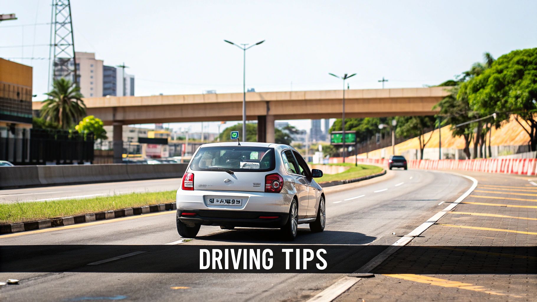 Your Guide to Car Rental Sao Paulo Guarulhos Airport A white car drives on a multi-lane highway under a concrete overpass on a clear, sunny day.