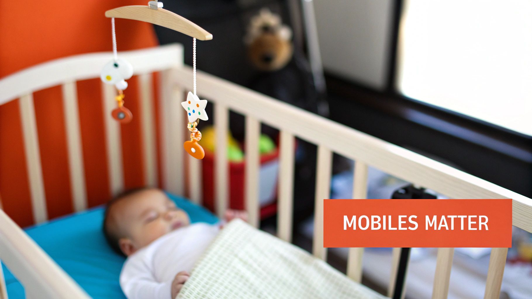 A colorful, whimsical mobile toy hanging above an infant's crib.