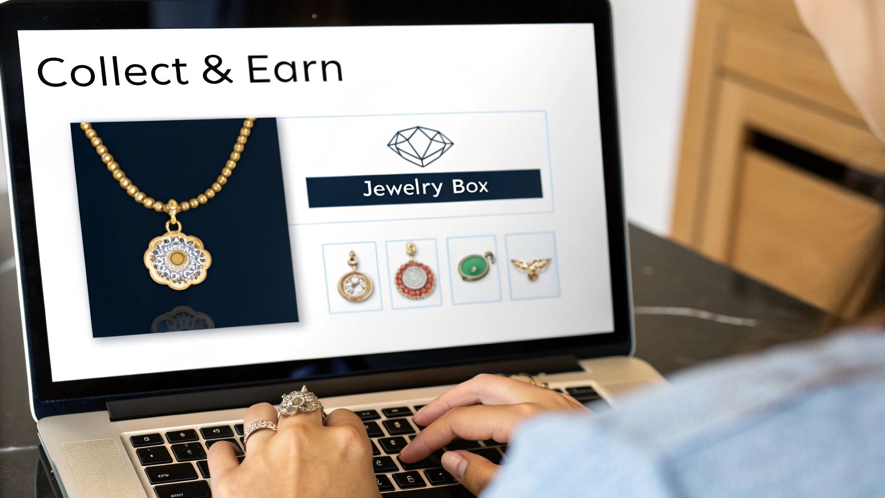 Person using a laptop displaying a 'Collect & Earn' jewelry website with various pendants and charms.