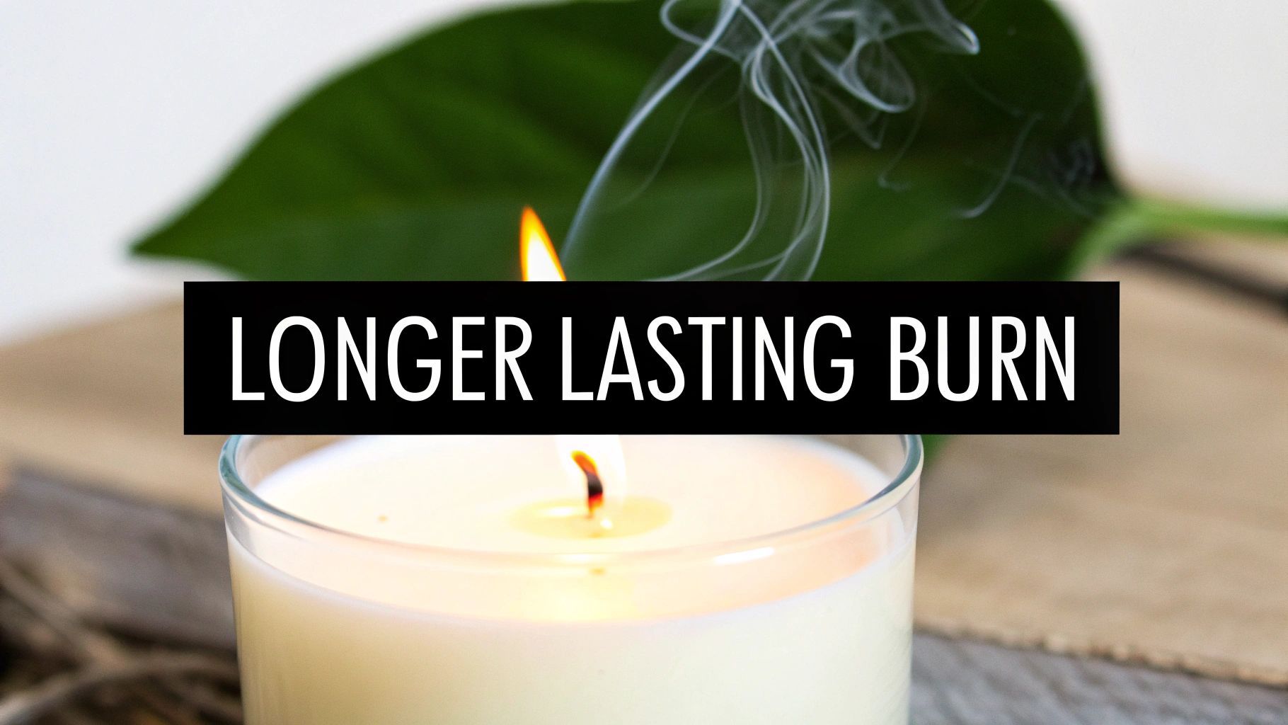 A lit candle in a glass jar emitting smoke, with a green leaf in the background, featuring 'LONGER LASTING BURN' text.