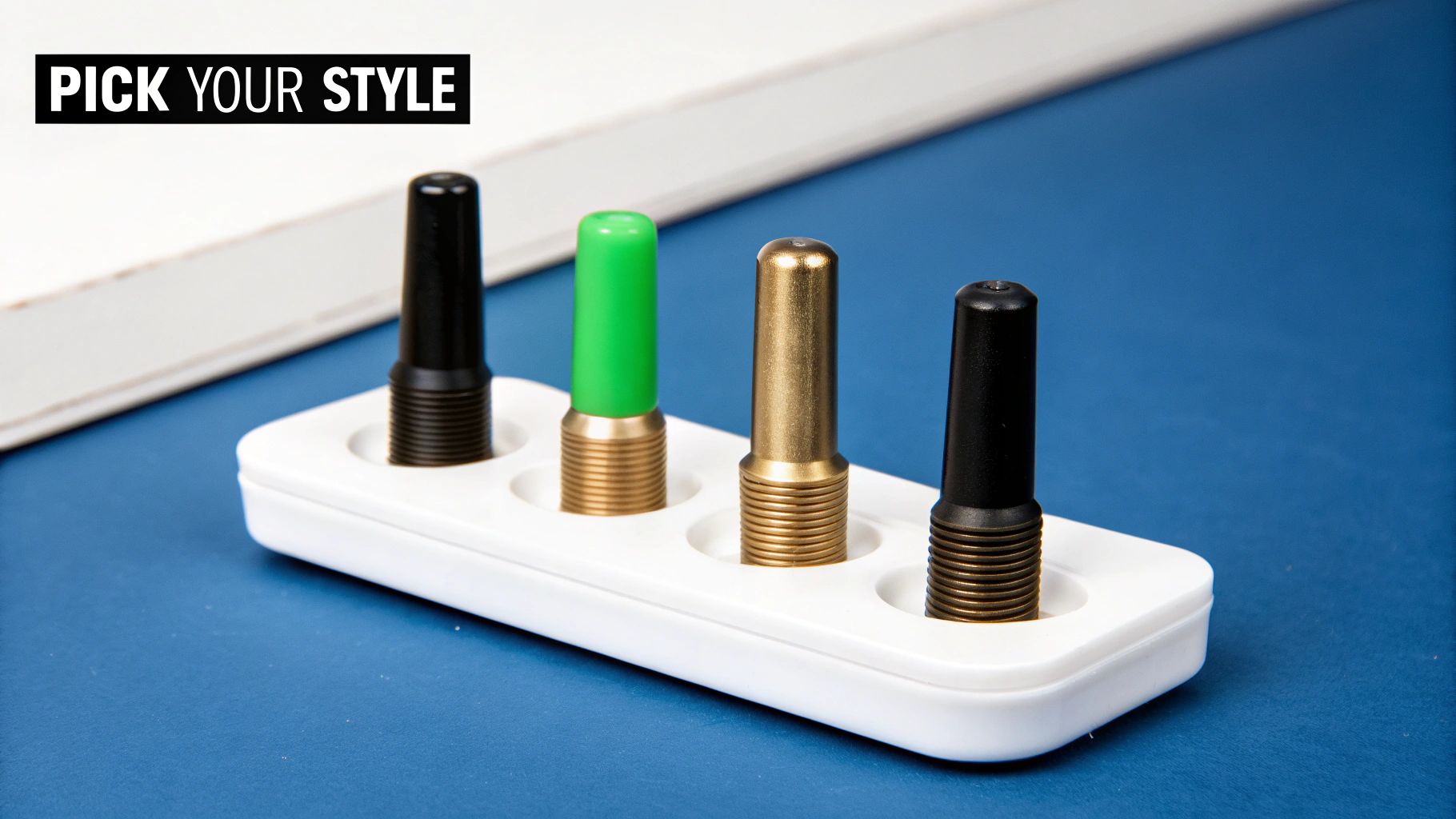 Four colorful earring gauge plugs in a white holder with 'Pick Your Style' text.
